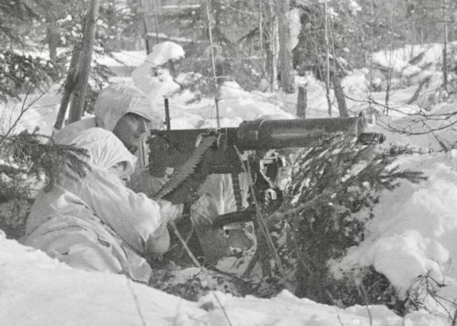 Finnish soldiers man a camoflauged Russian Imperial army field gun dating from WWI. Photo credit SA-Kuva Finnish soldiers man a camoflauged Russian Imperial army field gun dating from WWI. Photo credit SA-Kuva