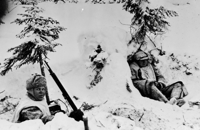 Finnish field telephone team during a battle at the front lines near Kollaanjoki, ca. January 1940. The soldier on the right is wearing what looks to be captured Russian felt boots. Photo credit SA-Kuva Finnish field telephone team during a battle at the front lines near Kollaanjoki, ca. January 1940. The soldier on the right is wearing what looks to be captured Russian felt boots. Photo credit SA-Kuva