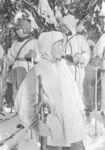 Simo Häyhä, aka the White Death, with his kit and rifle, the Finnish Mosin-Nagant, which had no scope. Note Häyhä’s snow suit, which included a face mask. Photo credit SA-Kuva