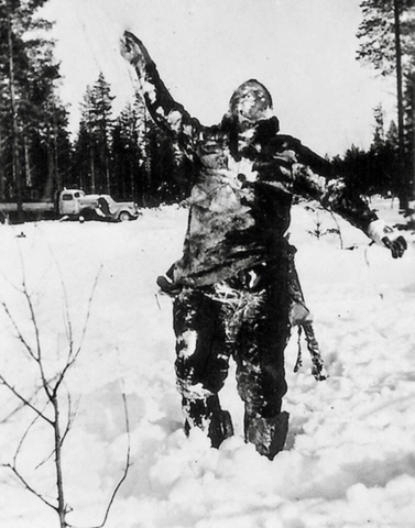Finnish black ops: frozen Russian used as a signpost or marker. Finnish soldiers frequently propped up Russian bodies to intimidate the Soviet troops. Photo credit SA-Kuva Finnish black ops: frozen Russian used as a signpost or marker. Finnish soldiers frequently propped up Russian bodies to intimidate the Soviet troops. Photo credit SA-Kuva