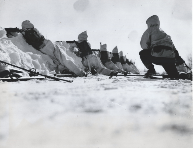 Troops of the 28th Infantry advance on skis over the snow-covered terrain of Pine Camp during the battle that served as the climax of the 1939-40 winter winter maneuvers. Courtesy Doug Schmidt/National Association of the 10th Mountain Division, Inc. Troops of the 28th Infantry advance on skis over the snow-covered terrain of Pine Camp during the battle that served as the climax of the winter maneuvers. Courtesy Doug Schmidt/National Association of the 10th Mountain Division, Inc.