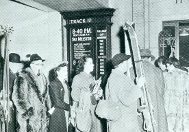 Skiers wait to board the snow train in New York’s Grand Central station. The snow trains became such a spectator sport for New Yorkers, Grand Central had to rope off areas to keep them away from skiers. Note raccoon coat and use of Germanic “Ski Meister” language. By the mid-1930s, German displaced Norwegian as skiing’s mother tongue. Photo credit: New England Ski Museum
