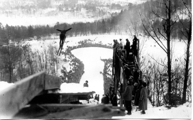 Bing Anderson of Berlin, NH, takes flight at Brattleboro VT during the first national meet held in the east, in 1924. He won the championship with a jump of 151 feet. As of March 2017, the official world record for the longest ski jump is 253.5 m (832 ft), set by Stefan Kraft at Vikersundbakken in Vikersund, Norway. Photo credit: New England Ski Museum
