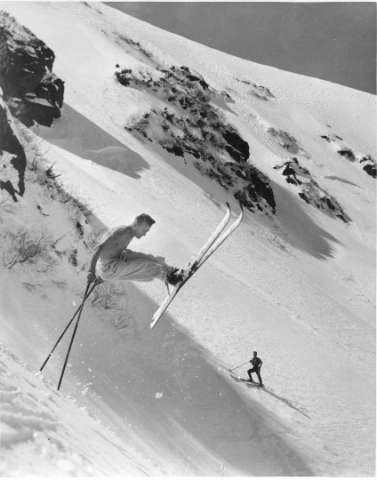 Sig Buchmayr, ca. 1937, showing off on Tuckerman headwall. Photo by Winston Poach, doyen of New England ski photography. The photo was used in an ad that read, “This is ski whiz Sig Buchmayer doing 40 mph on Tuckerman headwall. It takes nerves and Camel cigarettes.”