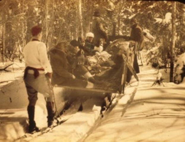 Urban skiers on a farmer’s sleigh in the mid-1920s in New England. Before the advent of tow ropes and lifts, ski outings were limited to a small number of ascents and descents, followed by a cup of coffee brewed by the farmer. Photo credit: New England Ski Museum