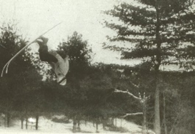 Norwegian skier Gustav Poulson at a Dartmouth meet, employing the trick that got him two full pages in a 1917 issue of National Geographic. Photo credit: New England Ski Museum